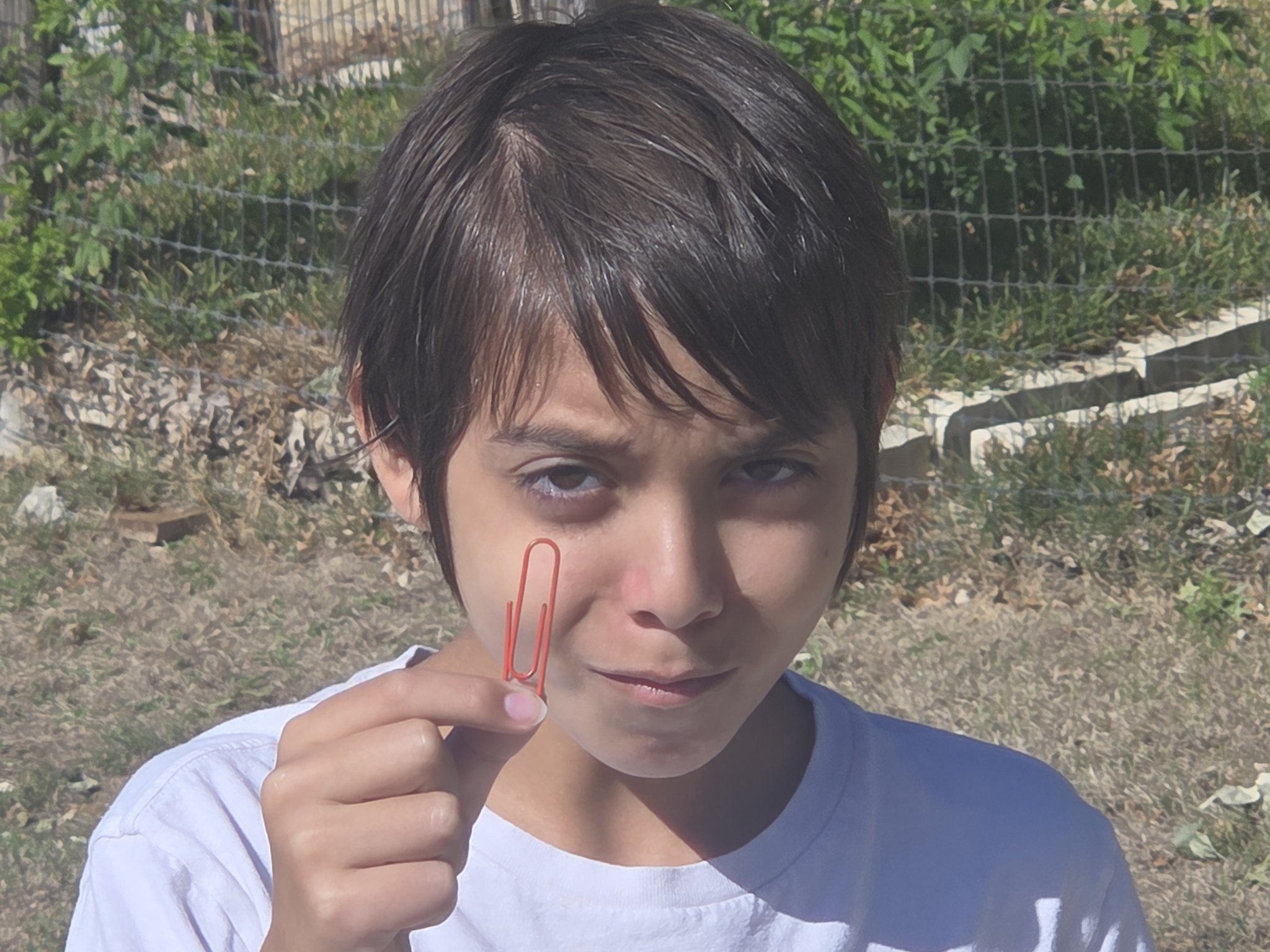 Atticus holding the starting paperclip before the first trade